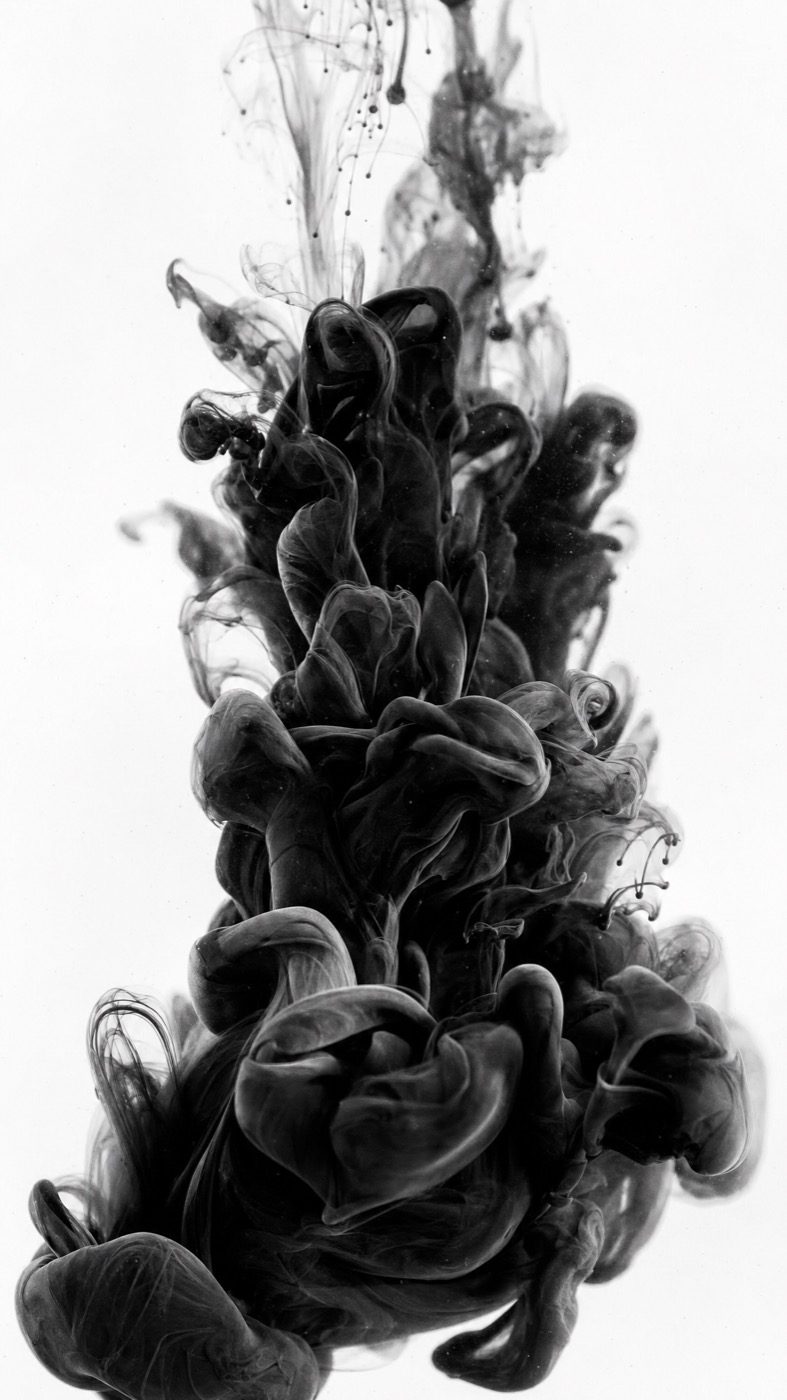 Black ink blooming in water on white — the media practice